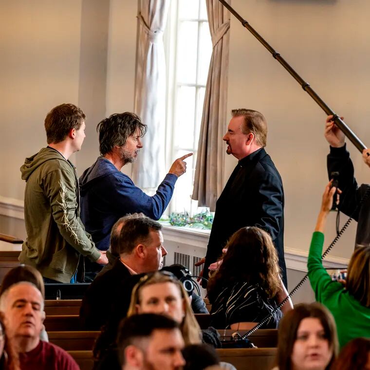 Actor Brian Dunkleman (left, co-host on the first season of "American Idol") confronts Brian O'Halloran (right, best known for “Clerks”) during filming of "Delco: The Movie" at the Springfield Presbyterian Church Tuesday.