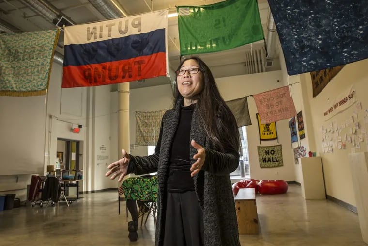 Gayle Isa talks about the beginnings of the Asian Arts Intitative in the main exhibit space of their building on Vine Street. Isa is leaving after  25 years at the helm. MICHAEL BRYANT / Staff Photographer