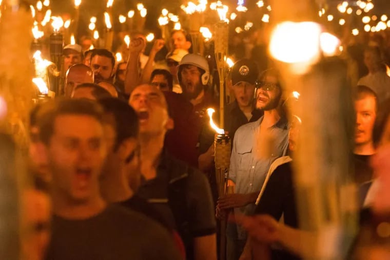 Neo-Nazis, white nationalists and white supremacists march through the University of Virginia the night before the Aug. 11 “Unite the Right” rally. The event was among those cited in a report that says anti-Semitic incidents have increased 60 percent nationally.