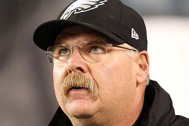 Eagles Head Andy Reid walks to the field after losing to the Carolina Panthers November 26, 2012. (Yong Kim/Staff Photographer)