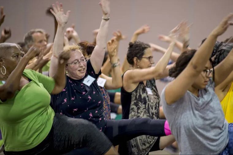 Reporter Ellen Dunkel  (left of center) rehearses at the Convention Center August 28, 2018 with some 150 non-dancers who make up the company of Le Super Grand Continental, a Fringe show.