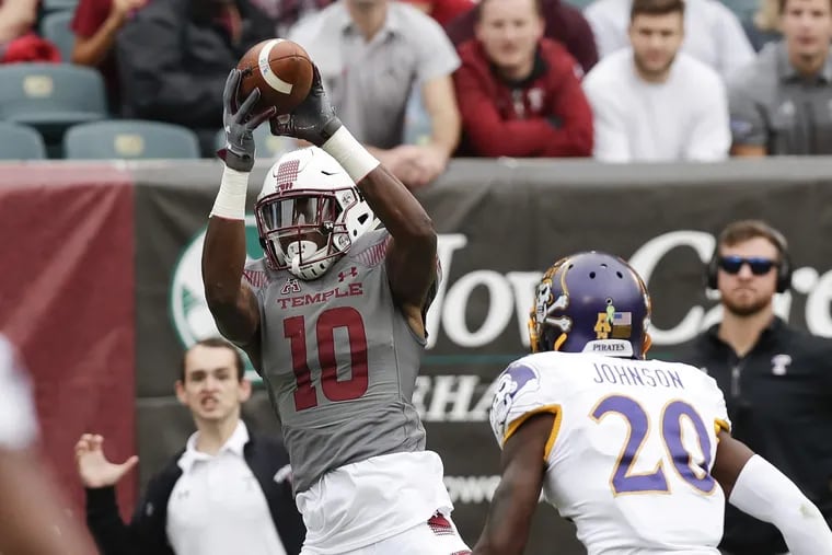 Temple wide receiver Sean Ryan catches a first-quarter touchdown past East Carolina defensive back Nolan Johnson on Saturday, October 6, 2018. YONG KIM / Staff Photographer