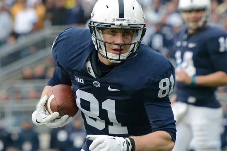 Penn State tight end Adam Breneman (81) carries the ball in the fourth quarter of an NCAA college football game against Illinois in State College, Pa., Saturday, Nov. 2, 2013. (John Beale/AP)