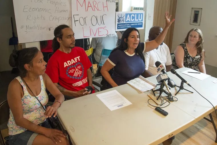 Activist Cheri Honkala (center), head of the Poor People's Economic Human Rights Campaign, announces at a press conference June 23, 2016, that the ACLU filed a lawsuit against the city for denying a permit to allow the campaign to march down South Broad Street on the opening day of the Democratic National Convention.