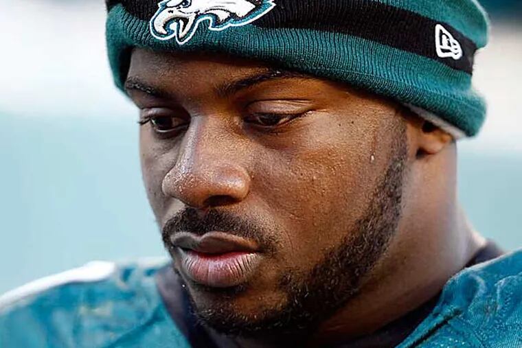 Fletcher Cox walks off the field during the third quarter with a concussion. (David Maialetti/Staff Photographer)