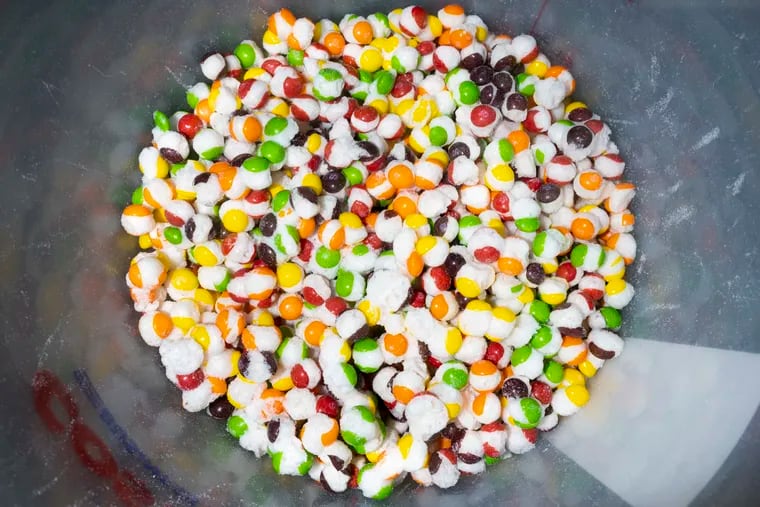 A batch of Scrunchums at Sugar Crunch in Lindenwold, Camden County. Skittles are the only ingredient in Scrunchums, which are producing by heating and vacuum-drying the candy.