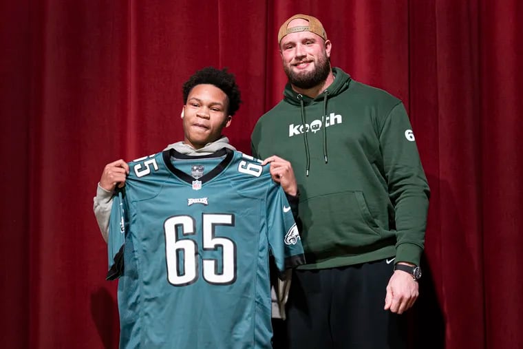 The Eagles' Lane Johnson posed for photos with the Northeast High School student Joshua Scotland on Nov. 28. Lane, spoke about mental health to more than 600 students.