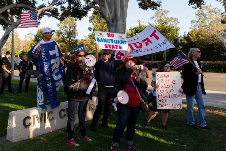 Protesters rally against a sanctuary-city law outside the Los Alamitos, Calif., City Hall in April 2018. MUST CREDIT: (Philip Cheung / Washington Post)