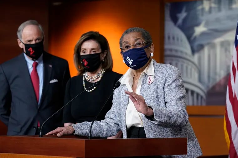 Del. Eleanor Holmes-Norton, D-D.C., center, joined from left by Sen. Tom Carper, D-Del., and House Speaker Nancy Pelosi, D-Calif., speaks at a news conference ahead of the House vote on H.R. 51- the Washington, D.C. Admission Act.