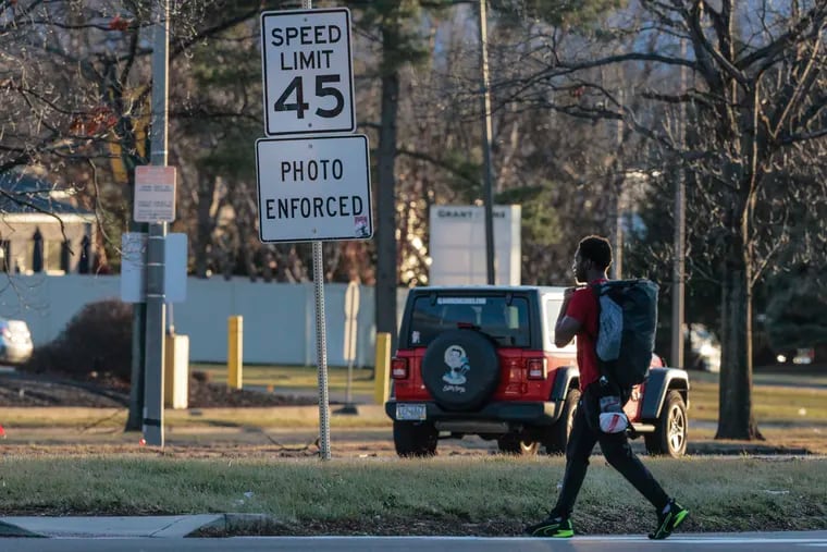 A man crosses Roosevelt Boulevard at Grant Avenue in January. A state study recommends expanding speed cameras statewide. Currently, they are only on the Boulevard as a “pilot” program that will expire in December without legislation.