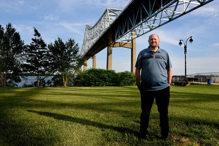 Film locations scout Rudi Fischer poses under the Commodore Barry Bridge in Chester June 2, 2021, one of the sites he helped scout in Delco, Montco, Chesco and Philadelphia where Mare of Easttown was shot.