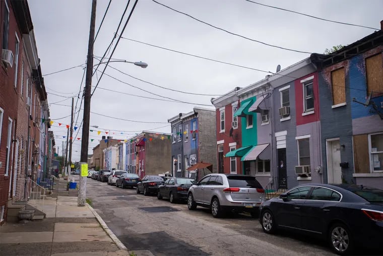 The 3800 block of Melon street in Mantua. Once a blighted block, the area has started to turn around - in part, thanks to the Philadelphia Mural Arts program.