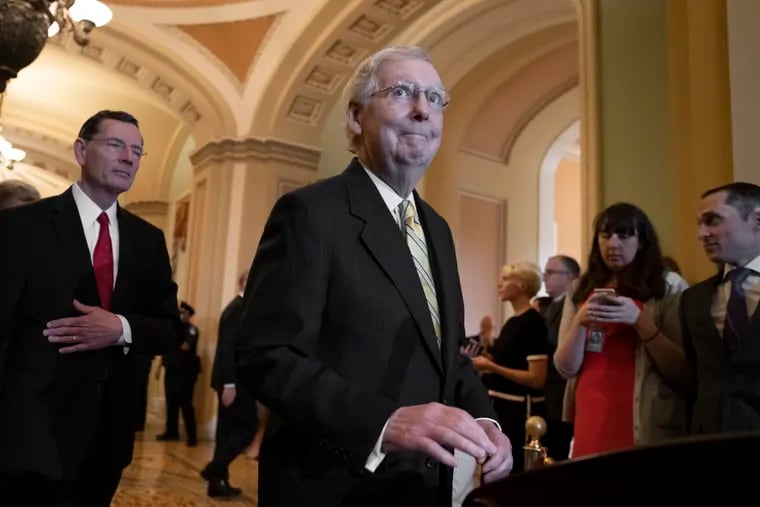 Senate Majority Leader Mitch McConnell (right) is joined by Sen. John Barrasso, (R., Wyo.), last month, answering questions about Senate Intelligence Committee Chairman Richard Burr (R., N.C.) and his decision to subpoena Donald Trump Jr.
