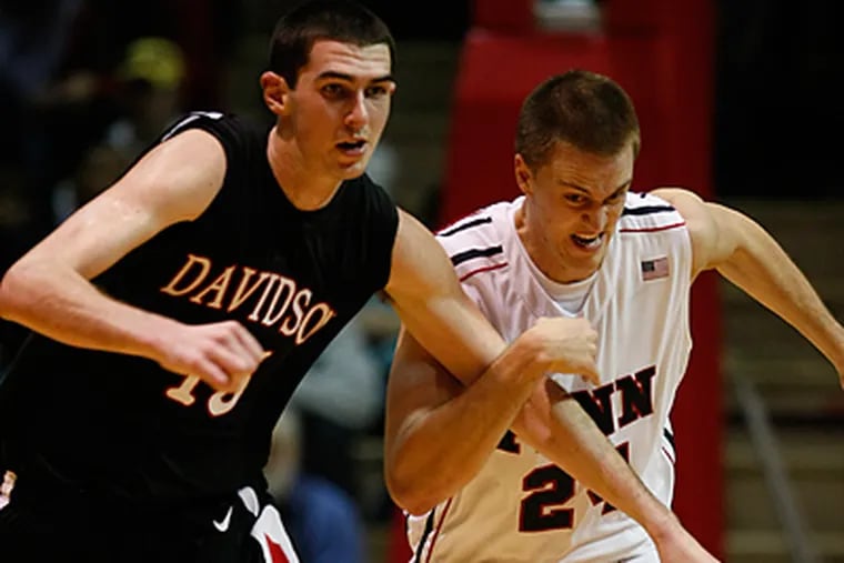 Penn's Jack Eggleston goes for the steal against Davidson's Jake Cohen in second half. (Ron Cortes / Staff Photographer)