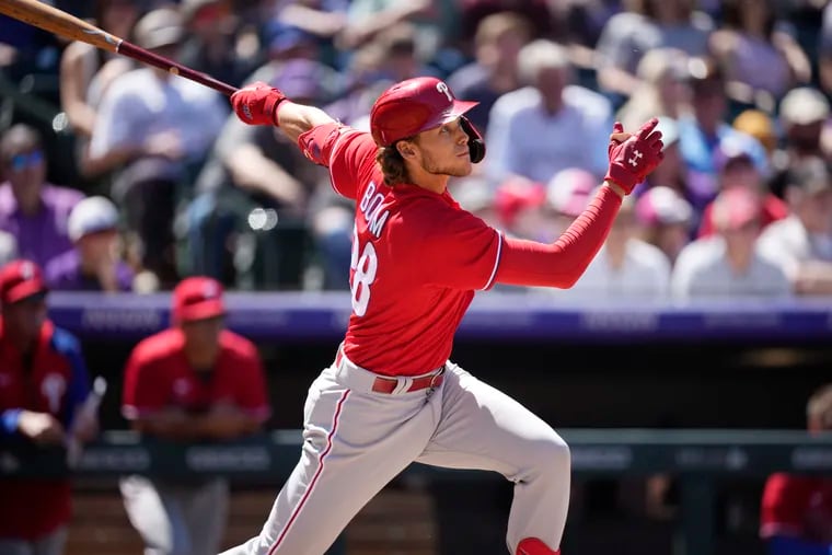 Phillies third baseman Alec Bohm follows the flight of his two-run home run off Colorado Rockies starting pitcher German Marquez in the fourth inning.