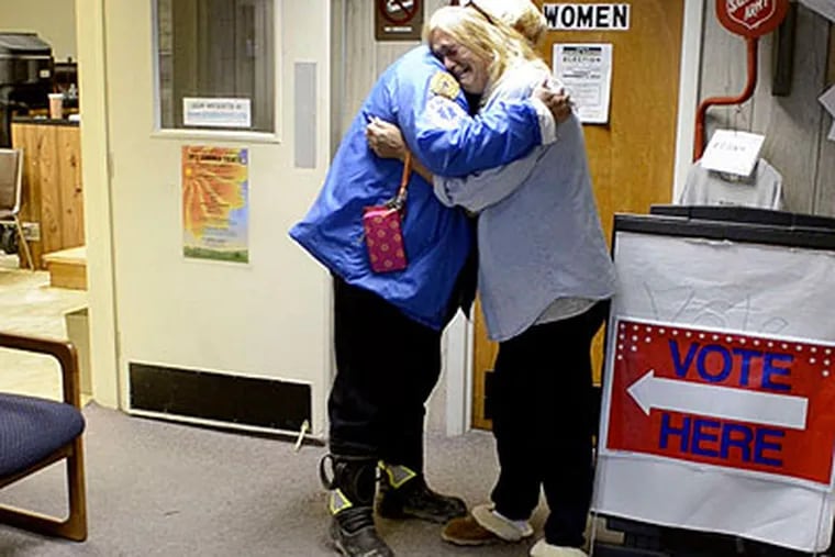 It's an emotional reunion for Beverly Tromm (right), deputy emergency management coordinator in Beach Haven, and Judi Hartney, a Surf City EMT, in Ship Bottom. (Tom Gralish / Staff Photographer)