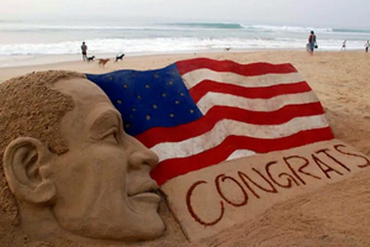 A sand sculpture on a beach in Puri, India, offers congratulations to Barack Obama. The global celebrations often were tempered by an awareness of the serious challenges Obama will face.