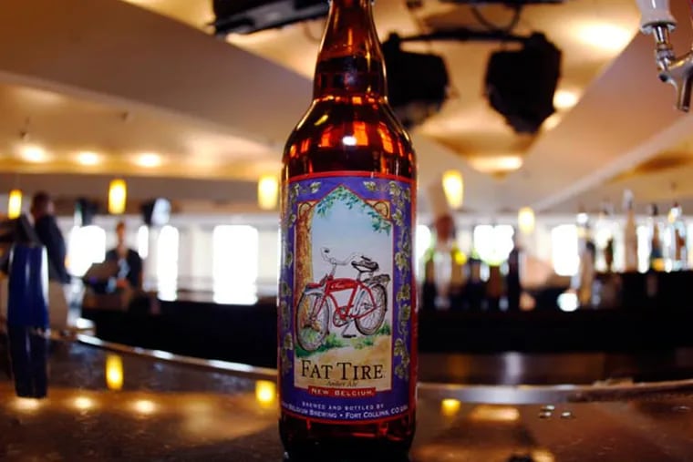 A boittle of Fat Tire Amber Ale sits on the bar in the club level of the Pepsi Center in Denver on Sunday, April 13, 2008.Fat Tire, New Belgium Brewing's flagship brew, is coming soon to Delaware. (AP Photo/David Zalubowski)
