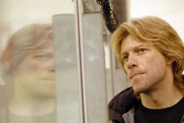 File photo of Jon Bon Jovi, part owner of the Philadelphia Soul, watching the team practice at the Tri-State Sports Complex. (April Saul / Staff)