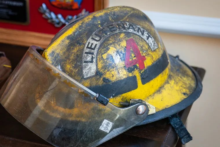 The helmet of Philadelphia firefighter Lt. Anthony Patterson, who died in 2022 of cancer, a leading cause of death for the profession.