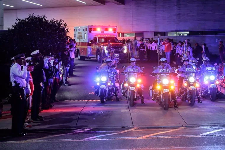 After two off-duty police officers were shot at the airport, one fatally, fellow officers came to pay their respects to fallen Officer Richard Mendez in a motorcycle procession that led the ambulance his body to the Medical Examiner's Office on Thursday.