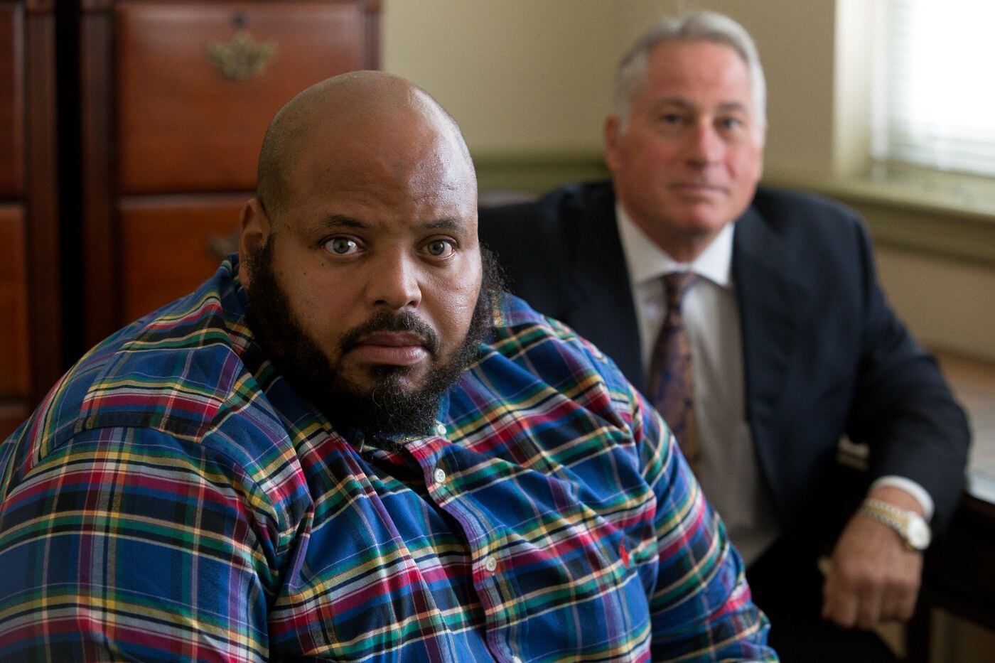 Kareem Torain, left, and his lawyer, Michael Pileggi, at his lawyer’s office in Philadelphia, Tuesday, Nov. 7, 2017. Torain was in prison for 13 years after being arrested on what he said was evidence fabricated by the narcotics squad behind hundreds of convictions that have since been tossed out. JESSICA GRIFFIN / Staff Photographer