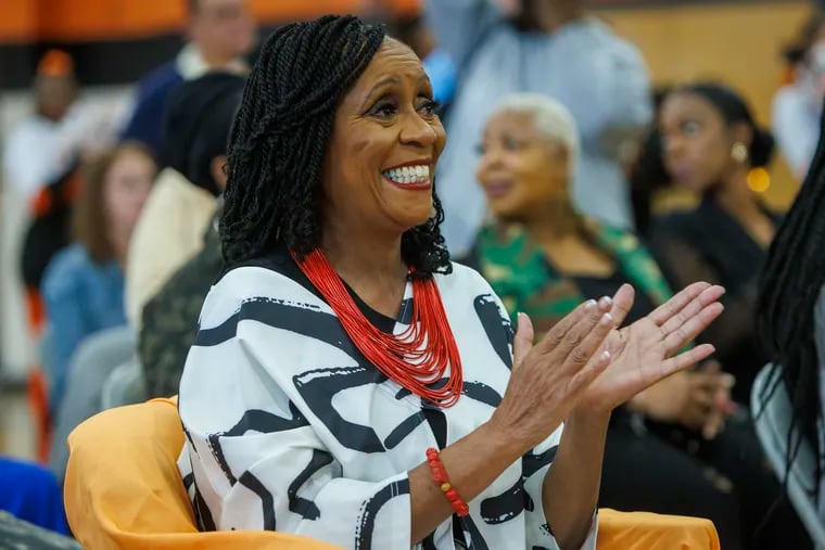 Retired Philadelphia school teacher Joyce Abbott applauding during ceremony where she is recognized at Overbrook High School for her accomplishments as a teacher and for being the inspiration for television show Abbott Elementary. Philadelphia School District is making Sept. 26 "Joyce Abbott Day," and city of Philadelphia named a street in front of Overbrook High School in honor.