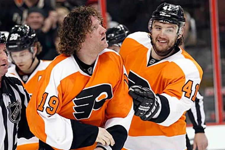 After scoring a goal, Scott Hartnell and Dion Phaneuf dropped the gloves. (Yong Kim/Staff Photographer)