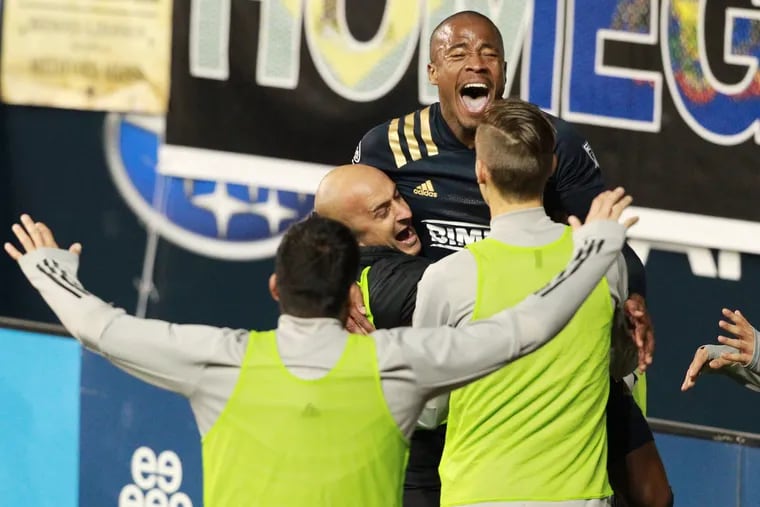 Sergio Santos, center, of the Philadelphia Union celebrates after his 3rd goal against the Toronto FC on Oct. 24, 2020  at Subaru Stadium in Chester, PA. The Union won 5-0.
