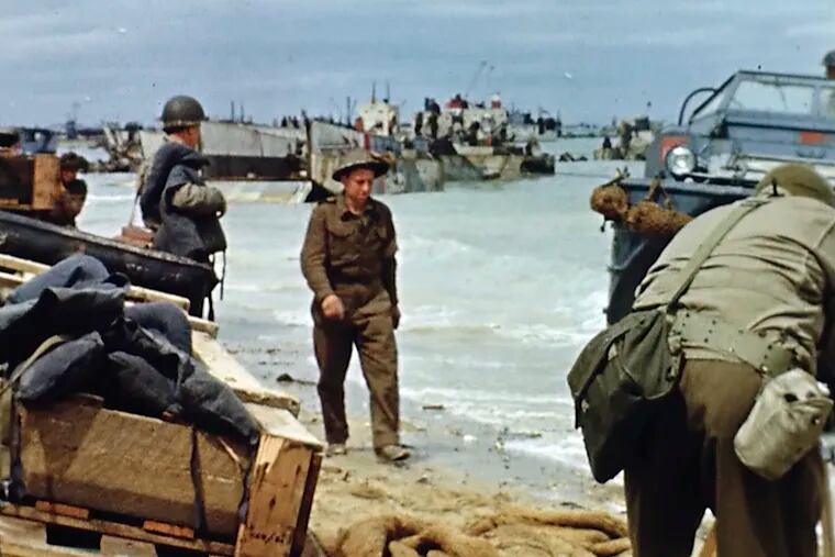 Landing craft on the beach during D-Day on June 6, 1944 in France. Seventy-five years later, surprising color images of the D-Day invasion and aftermath bring an immediacy to wartime memories. They were filmed by Hollywood director George Stevens and rediscovered years after his death.  (War footage from the George Stevens Collection at the Library of Congress via AP)