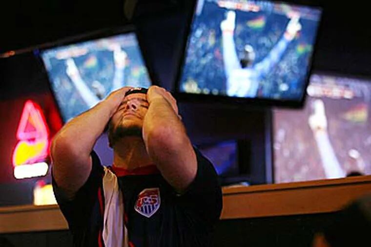 A fan reacts after watching Ghana knock the United States out of the World Cup. (Victor Calzada/El Paso Times/AP)