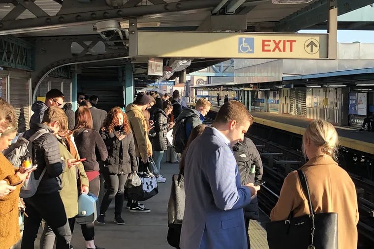 Riders crowd the Girard Station along the Market-Frankford Line on Monday, the first day of the elimination of its long-standing skip-stop service.