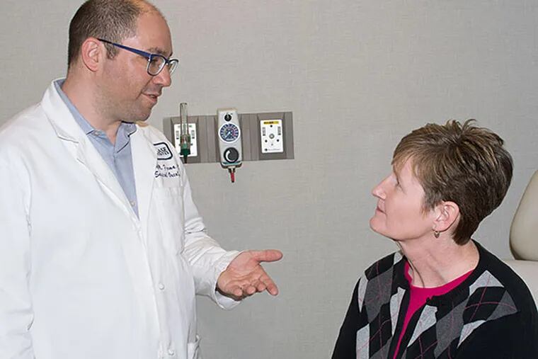 &quot; Cancer wreaked havoc on our finances. . . .You feel like you're in quicksand, and you have no one to pull you out.&quot; Melanoma patient Donna Piunt (with oncologist Jeffrey M. Farma)