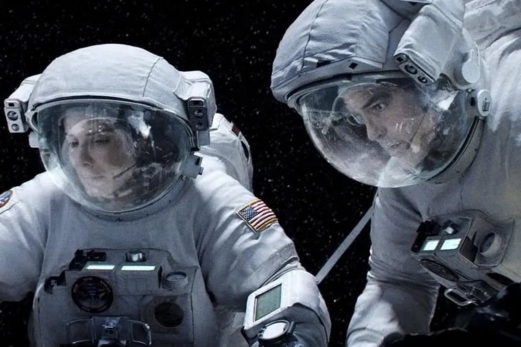 Sandra Bullock and George Clooney are astronauts caught in a storm of space debris in Alfonso Cuar&#0243;n's gut-wrenching and groundbreaking &quot;Gravity.&quot;