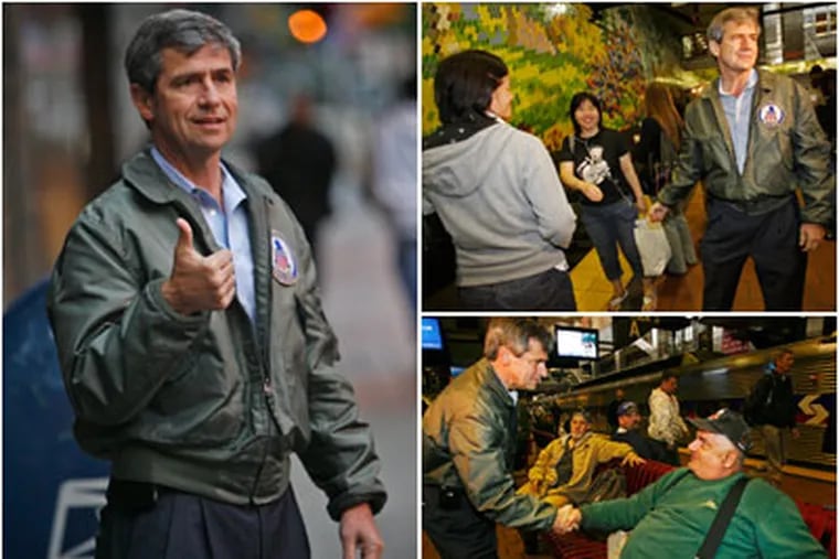 Wearing a leather bomber jacket, Joe Sestak, 58, started his day shaking hands of commuters at Philadelphia's Market Street East station before 6 a.m., the day after defeating Sen. Arlen Specter.  His Republican opponent, Pat Toomey, was also in Philadelphia for a round of television appearances. (Alejandro A. Alvarez / Staff Photographer)