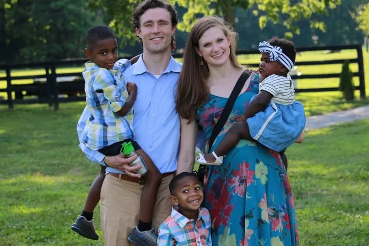 Graham and Lindsey Johnson with kids (left to right) Pax, Titus and Nova.