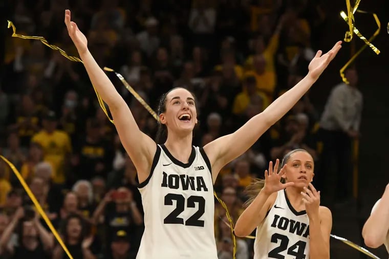 Caitlin Clark (22) celebrates during Senior Day ceremonies after a victory over Ohio State in which she became the top scorer in the history NCAA Division I men's or women's basketball.