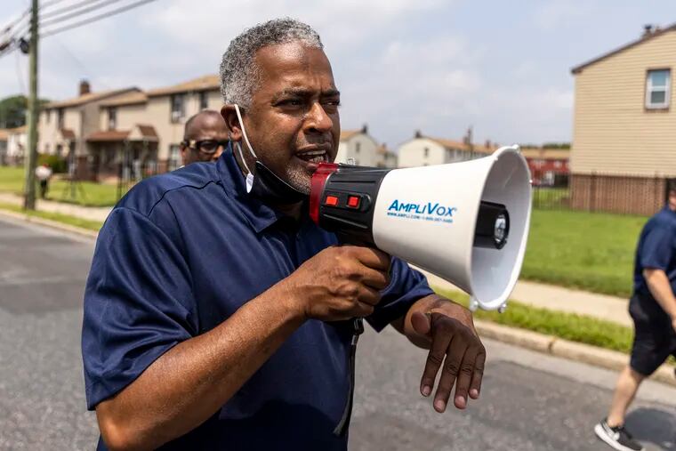 Mayor Vic Carstarphen, marches and speaks out towards the community to encourage them to get their vaccination in Camden, N.J., on Tuesday, Aug., 10, 2021.