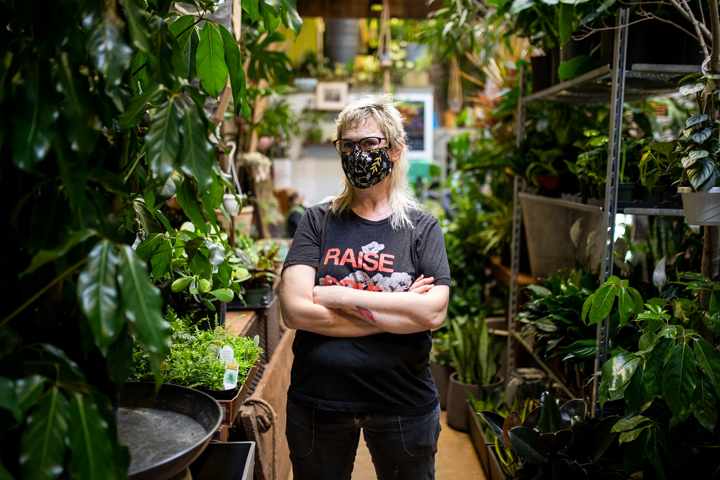 Sue White, owner of City Planter, poses for a portrait inside her shop on Tuesday, Feb. 9, 2021. White and her fellow employees started “The Garage,” where they sell inexpensive cuttings of plants and merchandise that doesn’t pass quality control. All the proceeds made are donated to different organizations every month. “It was awesome,” White said. “The first donation we made was very exciting. We didn’t know people would be interested.”