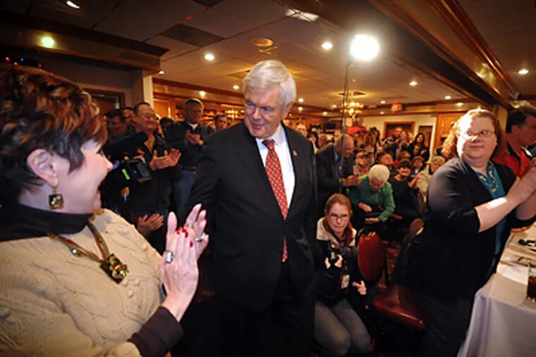 Republican presidential candidate former House Speaker Newt Gingrich talks to supporters on Wednesday during a campaign stop in Council Bluffs, Iowa. (Dave Weaver / Associated Press)