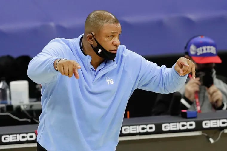 Doc Rivers points to his team during a game against Charlotte.