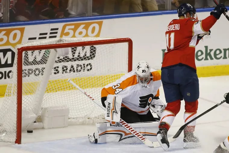 Florida’s Jonathan Huberdeau celebrates as he scores against Flyers goaltender Petr Mrazek in the Panthers’ 4-1 win Sunday. The Flyers’ defense has been shaky in front of Mrazek in recent games.