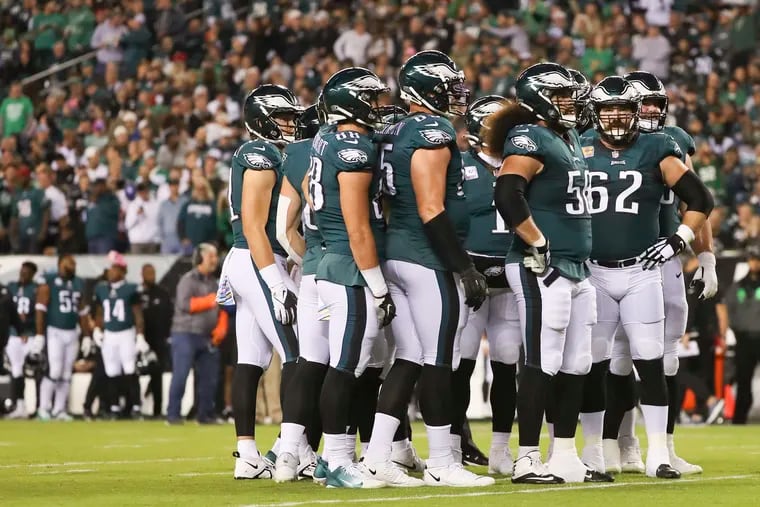 The Eagles offense waits for the start of play  during the Sunday night win against the Dallas Cowboys.