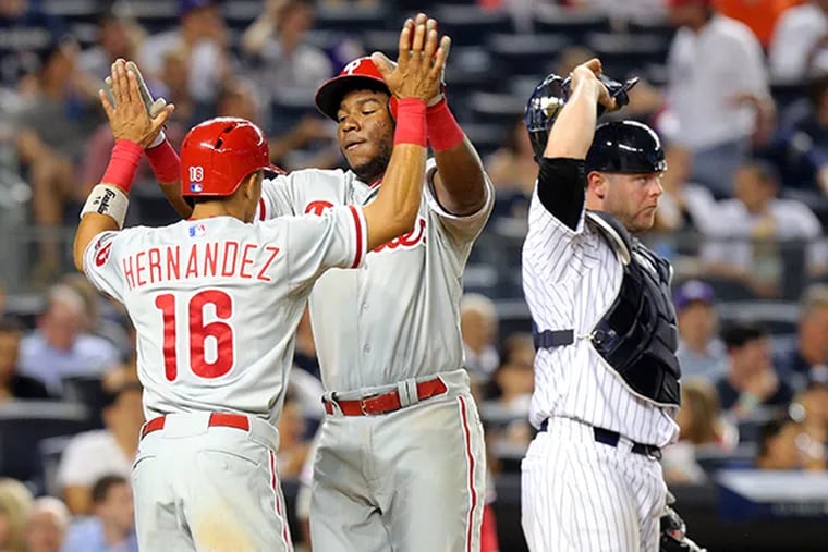 Phillies third baseman Maikel Franco (7) is congratulated by second baseman Cesar Hernandez (16) after hitting a two-run home run against the New York Yankees during the sixth inning at Yankee Stadium. (Brad Penner/USA Today)