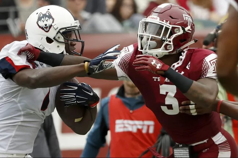 Temple’s Sean Chandler, right, pushes UConn’s Tre Bell out of bounds on Oct. 14.