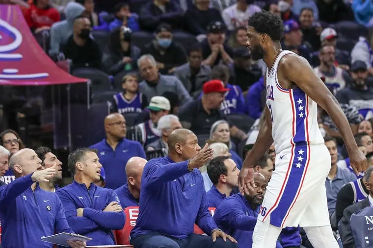 Sixers center Joel Embiid high-fives Doc Rivers and the coaching staff on his way to the bench during a game against the San Antonio Spurs at the Wells Fargo Center in Philadelphia on Saturday, Oct. 22, 2022.