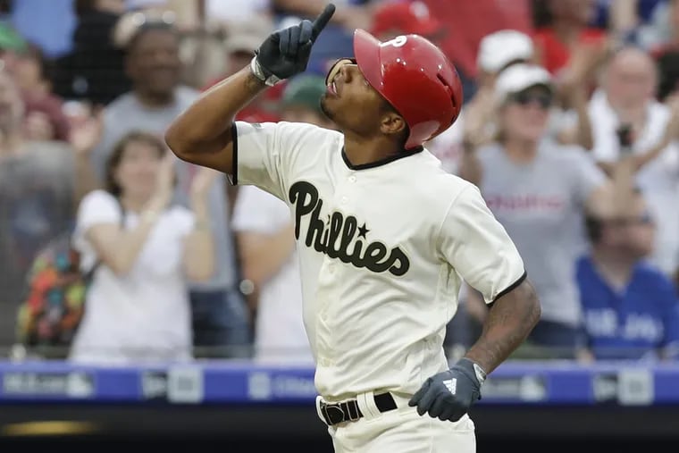 Phillies outfielder Nick Williams points to the sky after hitting a eighth-inning solo home run against the Toronto Blue Jays on Saturday. 