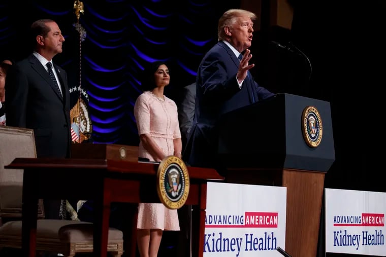 Secretary of Health and Human Services Alex Azar and administrator of the Centers for Medicare and Medicaid Services Seema Verma look on as President Donald Trump speaks during an event on kidney health at the Ronald Reagan Building and International Trade Center, Wednesday, July 10, 2019, in Washington.