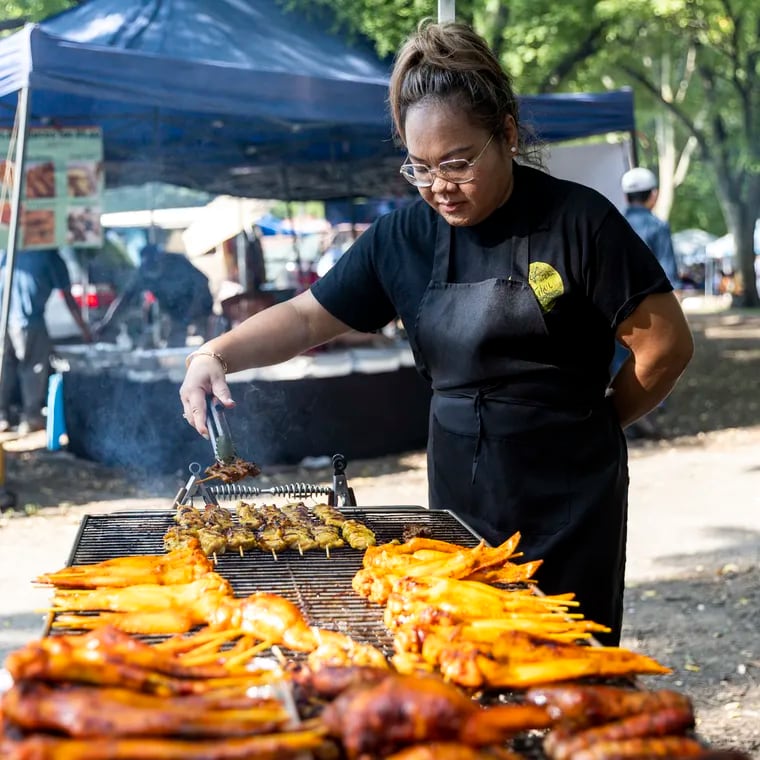 Chanthea Nhep, Owner of Vee’s Kitchen, is cooking and prepping food for people visiting the Southeast Asian Market at FDR Park in Philadelphia, Pa., Saturday, Sept., 17, 2022.