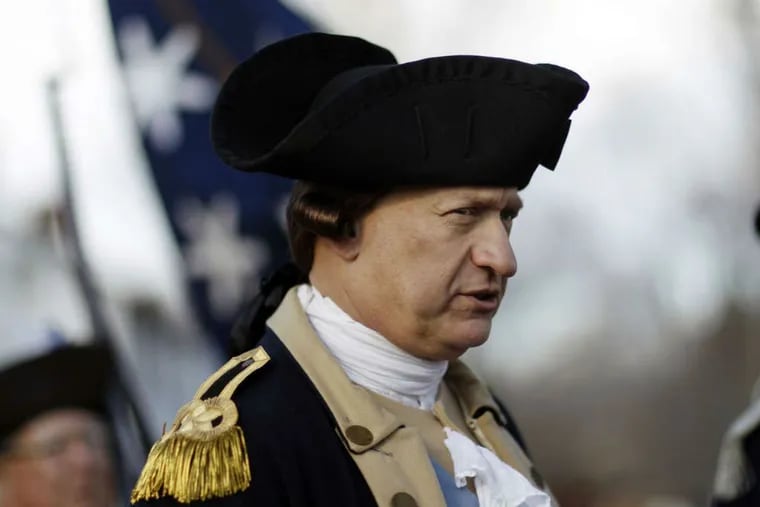 Gen. George Washington , played by John Godzieba, readies himself to cross the Delaware River yesterday, in the 62nd annual re-enactment of the boat trip that turned the tide of the Revolutionary War.